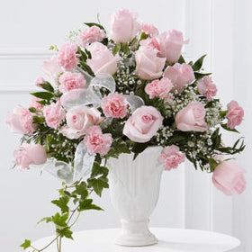 2 dozen pink roses in a vase