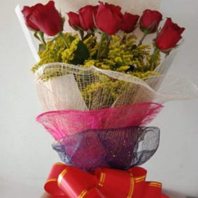 12 red roses with fillers in a Bouquet