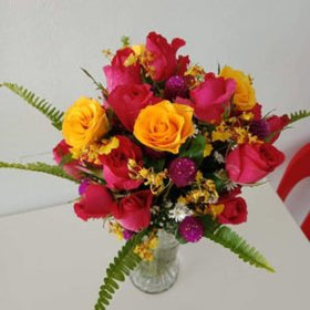 12 pcs mix colored roses in a vase