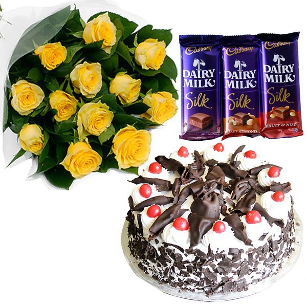 1 Dozen Yellow Roses with 3 pcs Cadburry and Black forest cake from Goldilocks