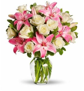 1 dozen White Holland Roses with 2 Pink Stem Lilies in a Vase