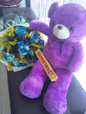 Purple 16inch Teddy with 1 Dozen Blue Roses and 100g Toblerone