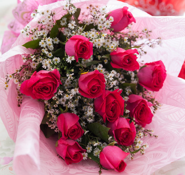 1 dozen Pink Holland Roses in a Bouquet